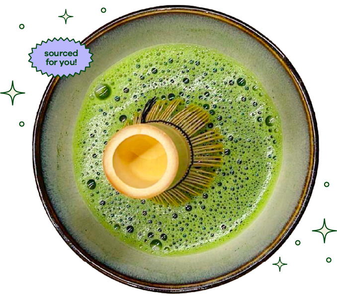 Matcha bowl with green tea powder and wooden whisk